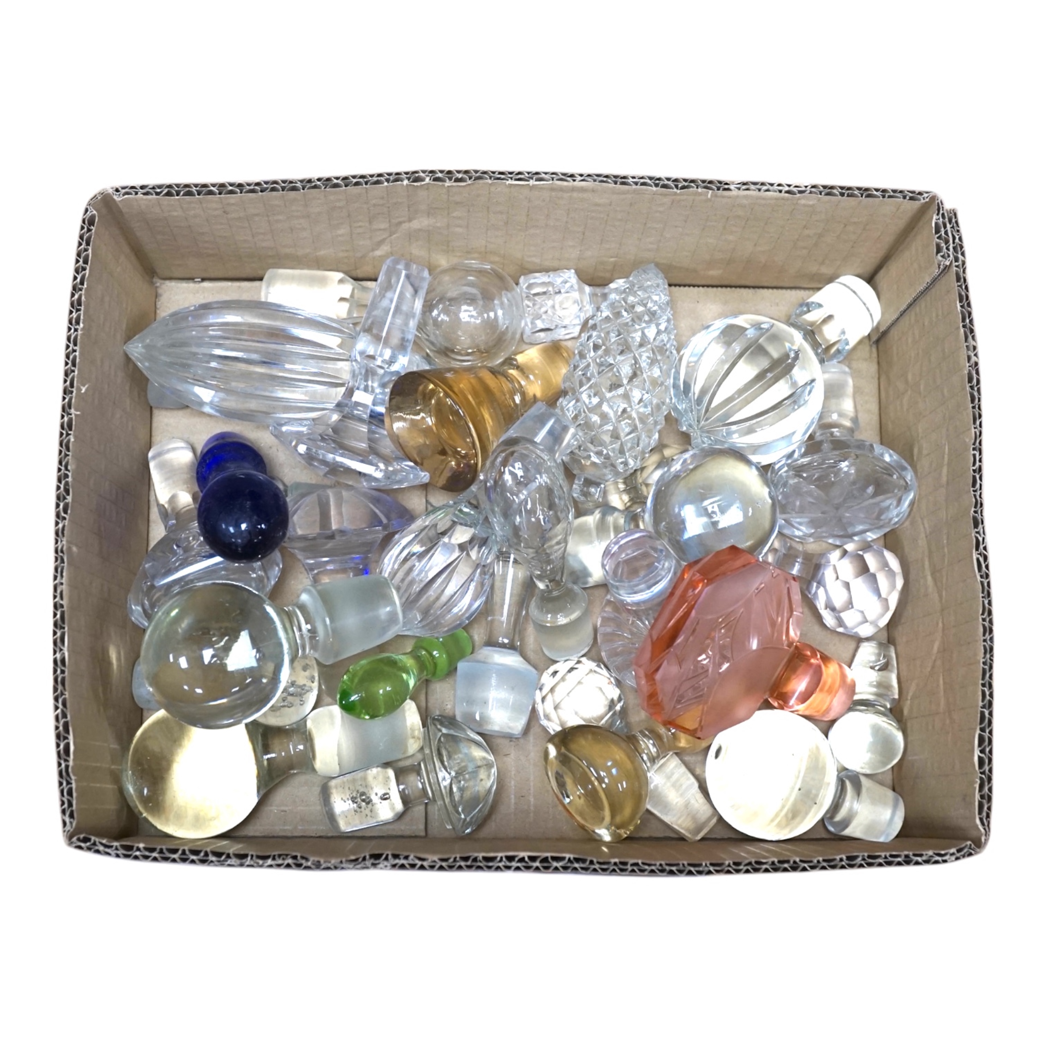 A collection of mixed clear and coloured glass decanter stoppers, Art Deco stopper 10cm high. Condition - generally fair